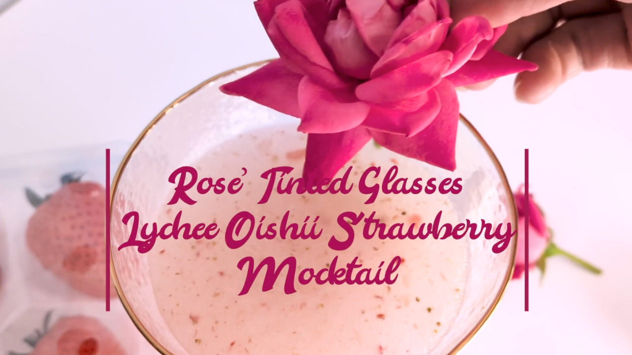 A lychee and strawberry mocktail using Apothekary's Rose' Tinted Glasses tincture for delicious mood support